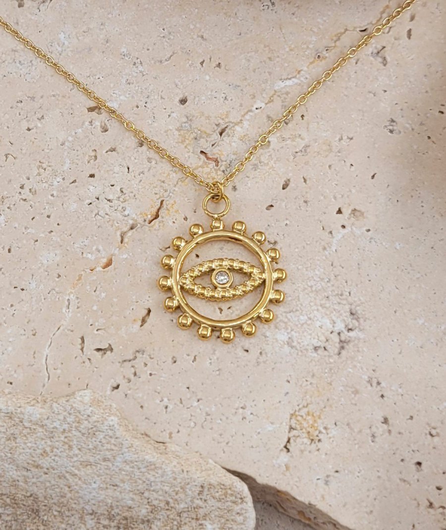 Ras du cou pendentif acier doré oeil solaire