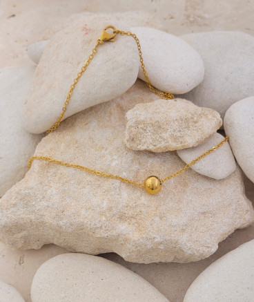 Ras du cou pendentif acier perle dorée