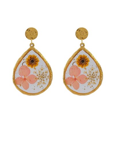 Boucles d'oreilles à clip en acier avec de vraies leurs séchées pour un effet très original – Création Tara Pépita